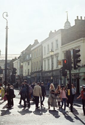 People crossing the street in a busy town